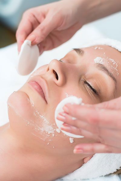 A person getting a relaxing and radiating face scrub at Sunset Marquis Spa.