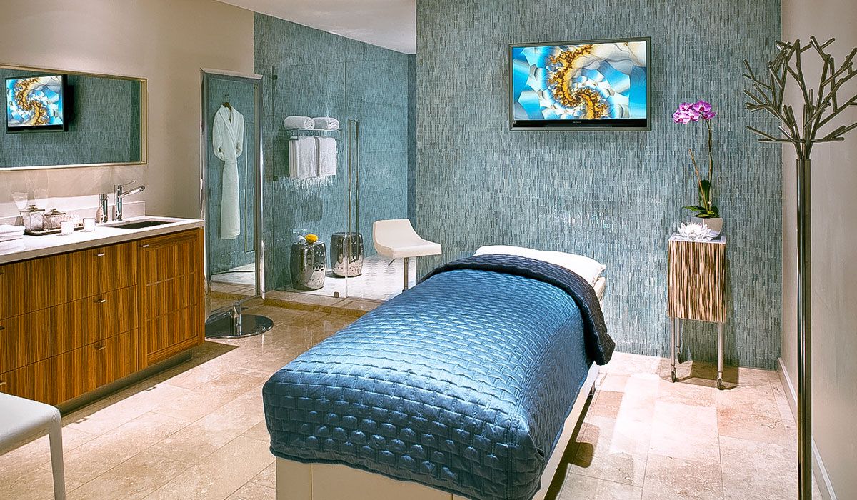 A private treatment room at Sunset Marquis with shower and Porsche massage bed. 
