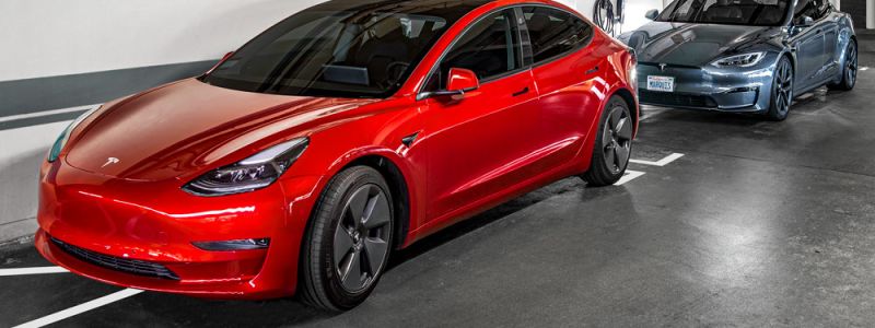 A TESLA plugged into a charging station at the Sunset Marquis in their Electric Vehicle garage. 