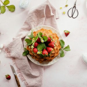 Table with Strawberry Cake and Easter Decorations