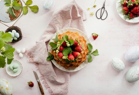 Table with Strawberry Cake and Easter Decorations