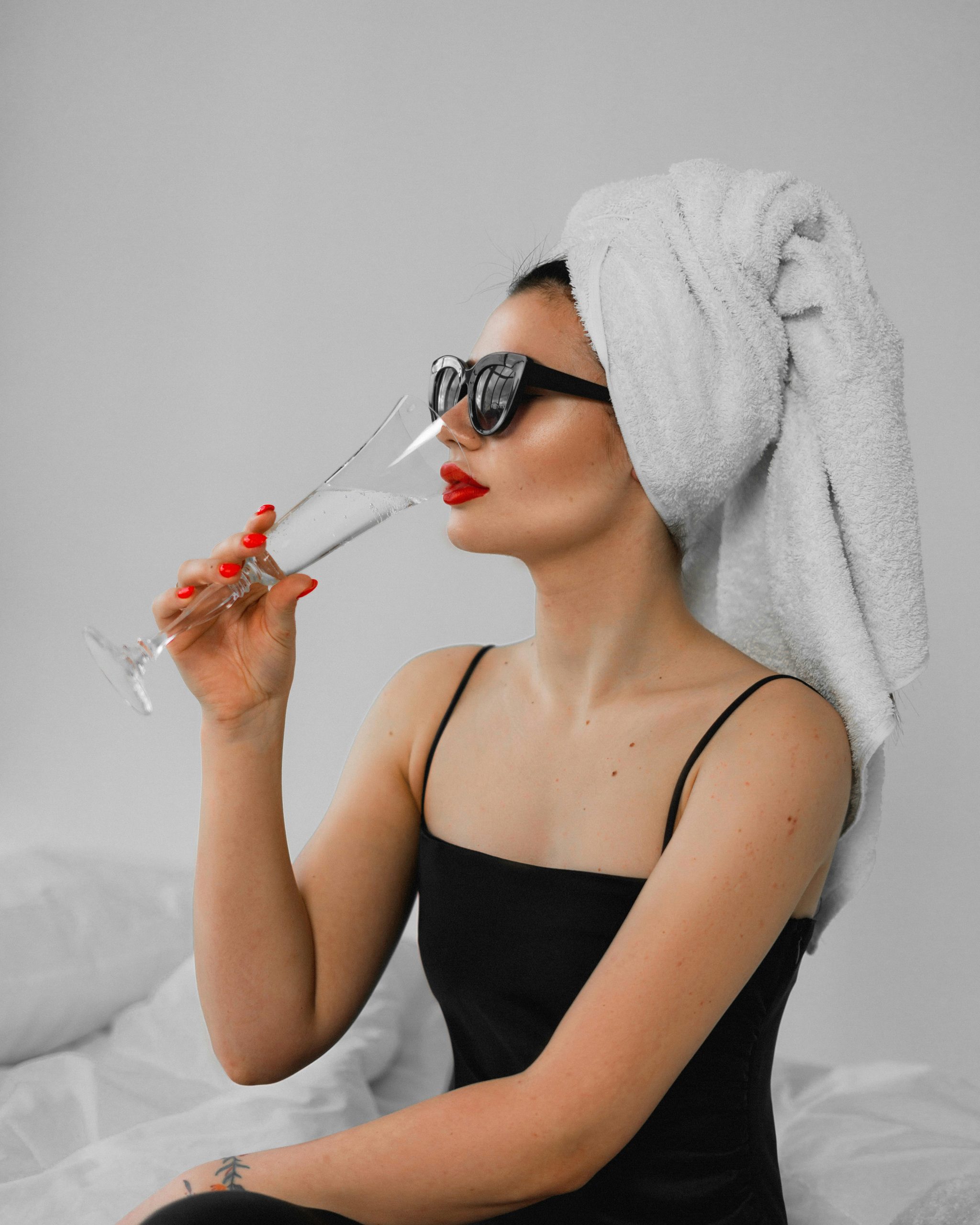 Woman Drinking Champagne at Spa