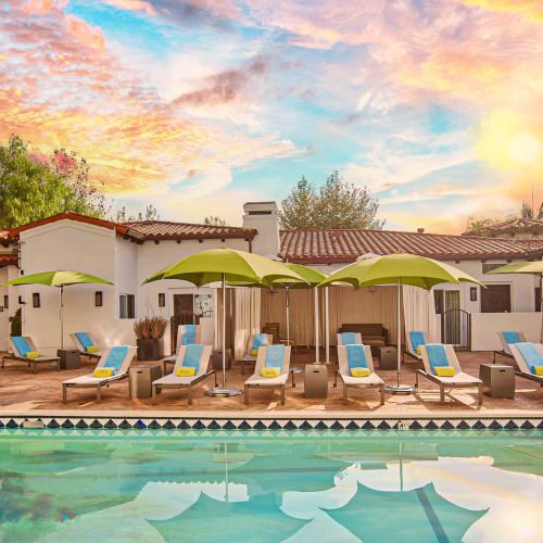 Sunset Marquis pool and lounge chairs at sunset